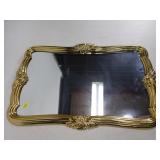 Gold ornate framed mirror