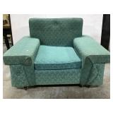 Wide armed vintage teal chair