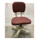 Industrial swiveling chair on wheels