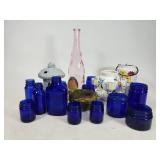Candleholders and blue jars