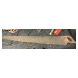large wood handled saw