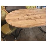 oval table with 4 matching rolling chairs