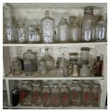 Three Shelves Of Jars & Bottles