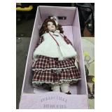 Large collectible porcelain doll. Approximately