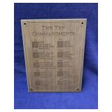 The ten commandments etched into wooden plaque