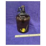 Antique one gallon roman bleach glass jug