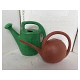 Green and brown watering cans