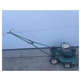 Vintage green lawn cruiser push lawn mower