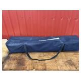White 10ï¿½ x10ï¿½ canopy in blue bag