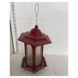 Red metal bird feeder