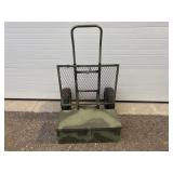 Green metal box mounted on dolly