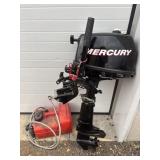Mercury boat motor and red boat gas tank