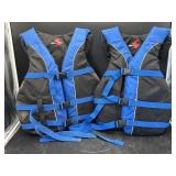 2 blue adult life jackets