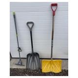 Yellow and grey shovel and mop handle