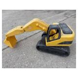 Yellow plastic backhoe toy
