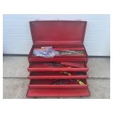 Red metal toolbox with contents