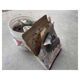 Pail of nail coils and blades