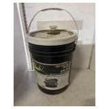 Approximately half full black pail of hydraulic