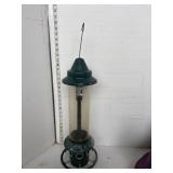 Green squirrel buster bird feeder