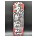 Metal thermometer- an old biker lives here