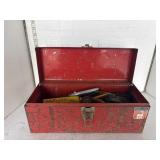 Red metal tool box with contents