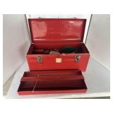 Red metal toolbox with contents
