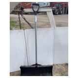 Black snow shovel