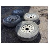 Four tires with rims: ST225/75R15