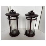 2 brown metal lanterns