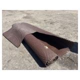 Partial roll of brown drainage membrane