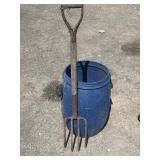 Blue barrel and potato fork