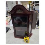 138. vintage-style wooden curio cabinet with a