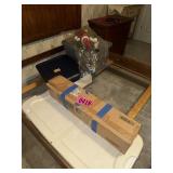 Contents within bed: artificial tree, tubs of