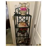 Contents of bathrrom: black metal shelf w/