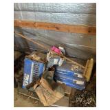 Pile of Quikcrete, broom, and wire fence