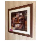 Framed abstract wall art in wooden frame