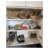 Cabinet contents: misc tools, masks, oils, mortar