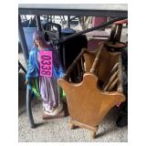 Ceramic Mary garden statue and wood magazine