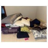 Assorted pillows and bedding