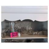 Contents of shelf - glass/crystal cups, plates,