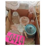 Flat of pink glass and perfume bottles