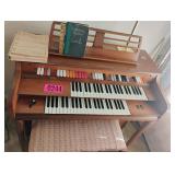 Piano with bench and sheet music