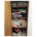 Contents of closet - asst towels and clothes