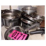 Contents of shelf - asst pots and pans