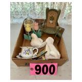Assorted decorative items including bird