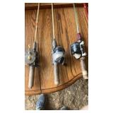 Three rod and reels and three cane poles