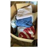 Several towels and rugs, including
