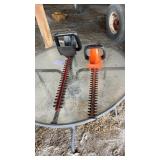 Two hedge trimmers