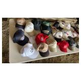 Large collection of hats including combat,