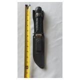 Large knife with leather sheath compass on end